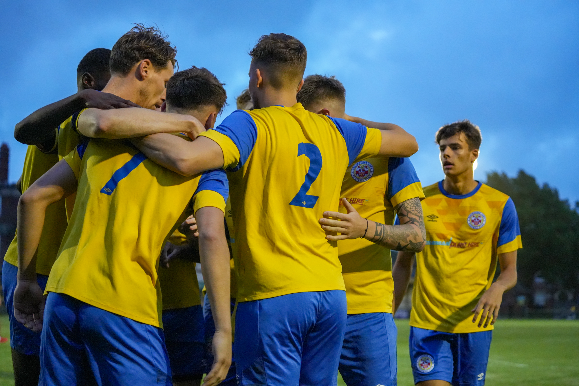 Eastbourne Town Mens Team Huddle To Celebrate Goal