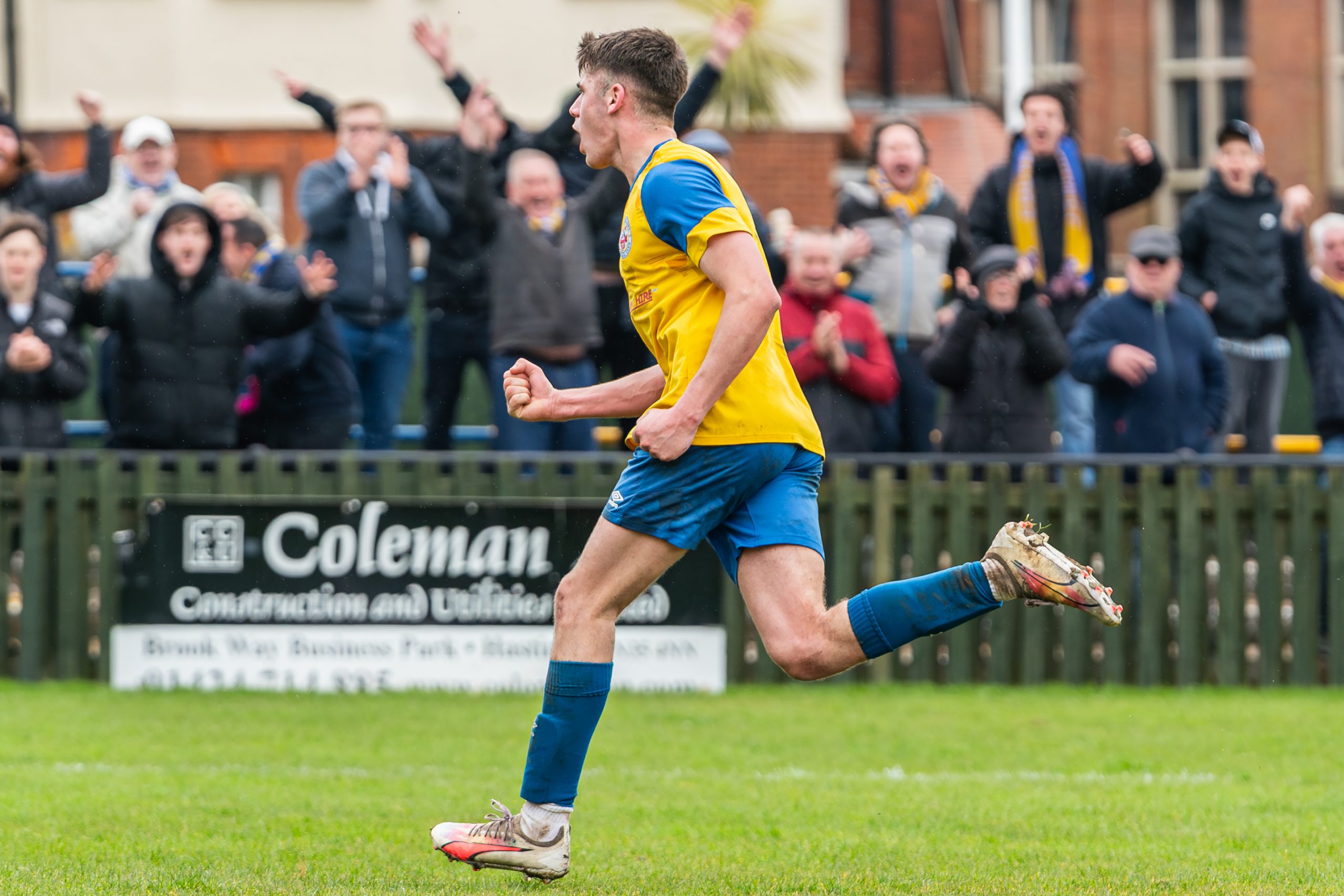 Ollie Davies celebrates infront of the Town fans after scoring against Eastbourne United