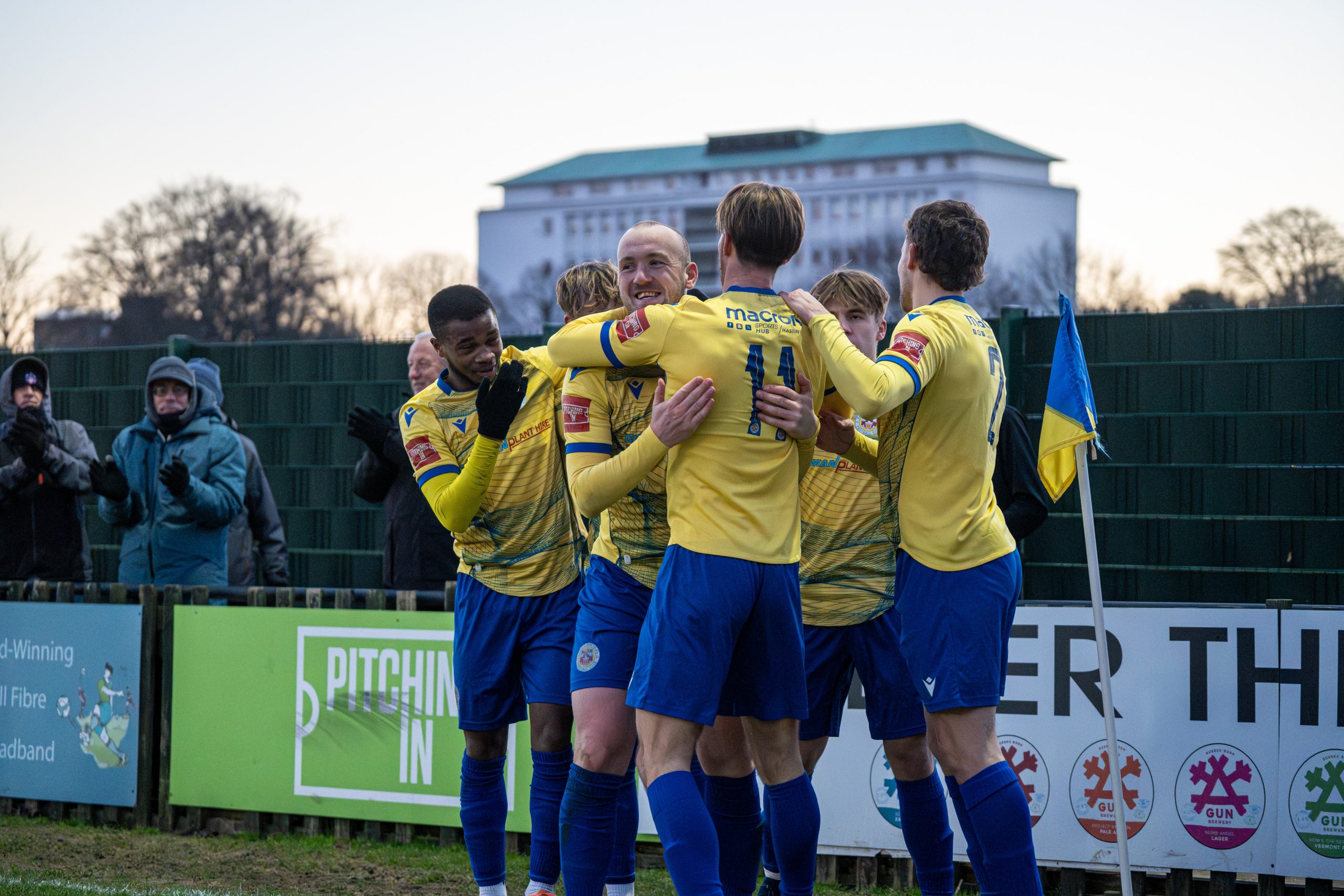 Billie Clark celebrates with Eastbourne Town teammates after scoring on his debut against Hassocks